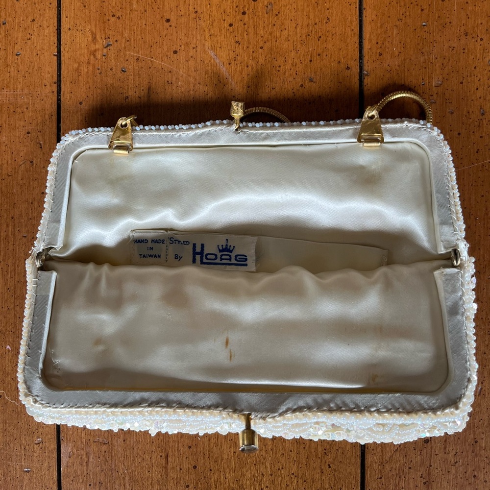 Vintage beaded clutch purse with gold clasp and handle. Styled by Hoag